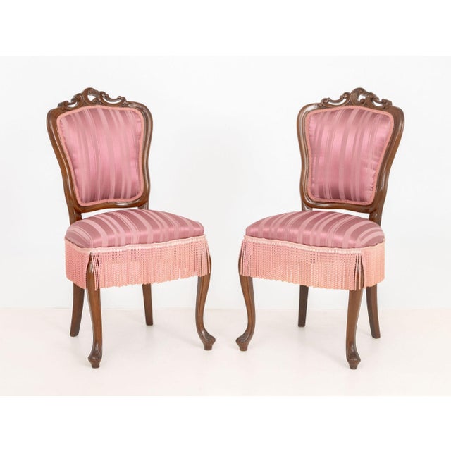 Pair of Victorian Style Walnut Slipper Chairs, with magenta silk blend upholstery and two lumbar cushions. 38" H x 19" W x...