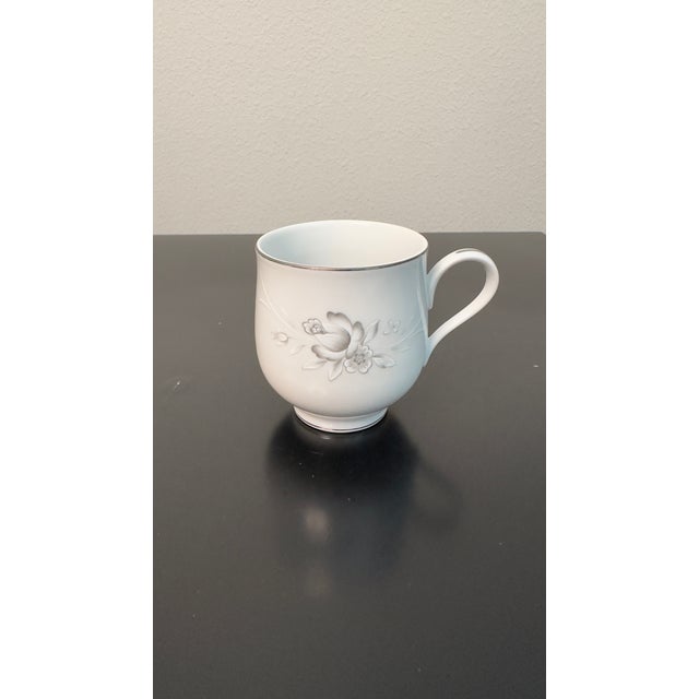 Set of 4 vintage porcelain tea cups from the Sango China Japan Morena 6280 collection. Features a classic white base with...