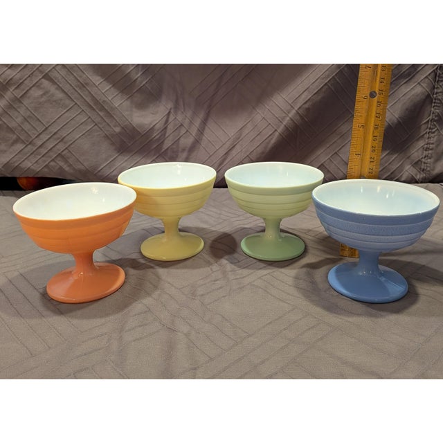 A highly collectible set of four vintage footed sherbet/dessert dishes from the 1940s, manufactured by the Hazel-Atlas...