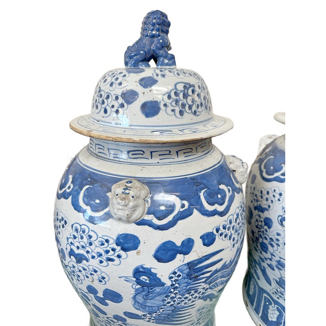 This is a contemporary pair of high quality porcelain blue and bone colored Baluster Temple Jar / Ginger Jar decorated...