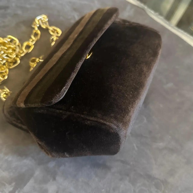 A captivating piece of late Mid-Century fashion, this vintage evening bag is a quintessential example of 1970s glamour....