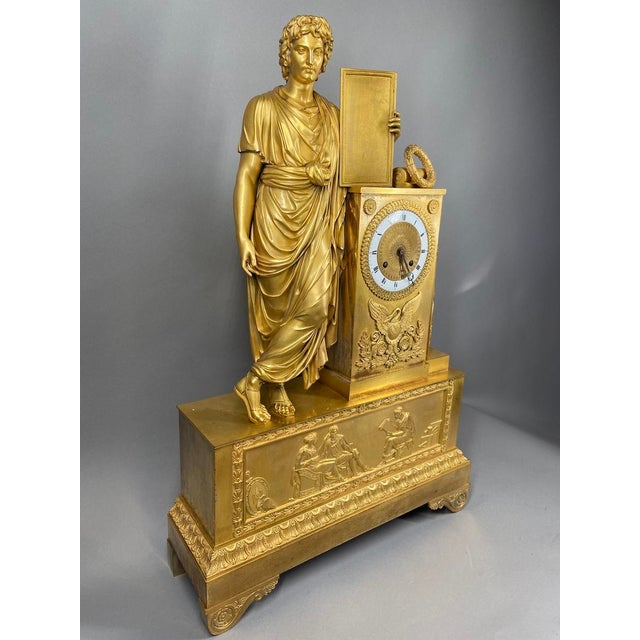 Own a remarkable piece of early 19th-century French decorative art with this monumental Empire mantel clock, crafted circa...