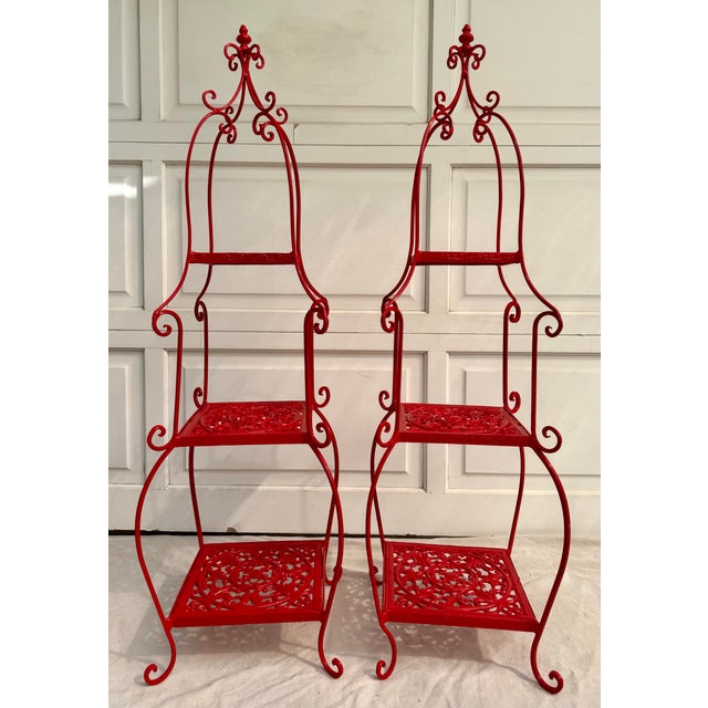 Here is a striking pair of pagoda-form metal étagères, likely dating to the late 20th century, likely 1970s, newly powder...