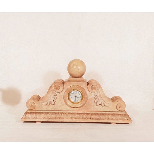 Elegant pendulum in molded and sculpted pink stone. Rare model in perfect condition Art Deco period around 1930 Signature...