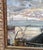 Oil painting of moody depiction of Stockholm’s amusement park, Gröna Lund, as it was in its early days. The scene shows...