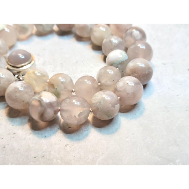 The length of the necklace is 17.5 inches (44.5 cm). The beads are 15- 16 mm — smooth round beads. The weight of the...