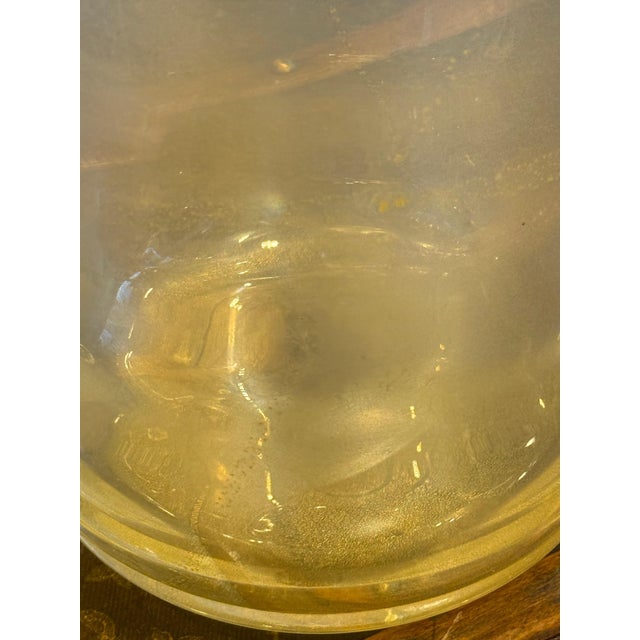 This spectacular vase boasts a highly unusual golden color and iridescent reflections that shift depending on the...