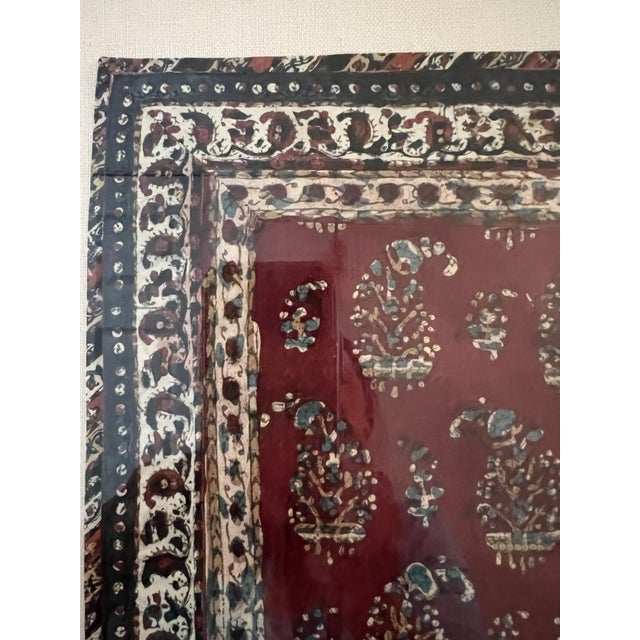 This vintage hand‑painted silk textile from Yazd, Iran features a rich maroon ground with repeating floral and botanical...