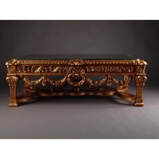 Monumental pomp salon table in Louis XVI style. Highly valuable solid beechwood carved in finest detail. Colored hand-...