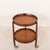 An elegant Italian mid-century teak round bar cart comes from the 1960s. The trolley features two trays surrounded by...
