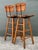 This handsome pair of swivel bar stools captures the iconic Mid-Century Modern aesthetic, designed in the distinct manner...