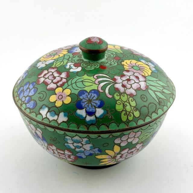 This vintage green Chinese cloisonné bowl with a beautiful floral enamel design is a unique and handmade piece that...