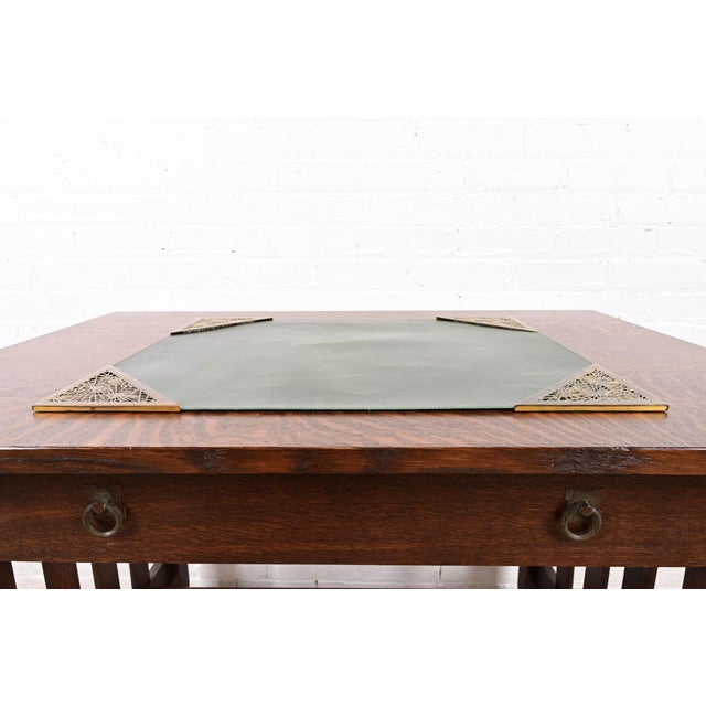 A gorgeous set of four Art Deco or Arts & Crafts period gilt bronze "Grapevine" pattern blotter corners with green leather...