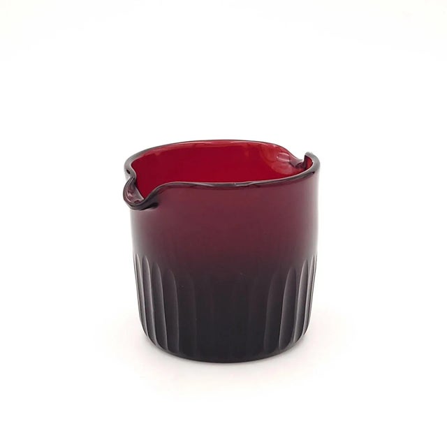 A red glass wine rinser, probably Georgian.