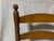 A pair of antique shaker cherry wood ladder back chairs with original rush caned seats, Ca. 19th c. A handsome pair of...