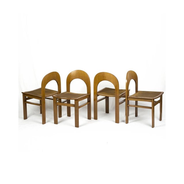 A sculptural set of 4 Arcadia dining chairs designed by Adalberto Caraceni for Tagliabue. Defined by their distinctive...