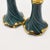 A stunning pair of ceramic Hollywood Regency style candlesticks. Each piece is shaped in a faux ruffle style, giving the...