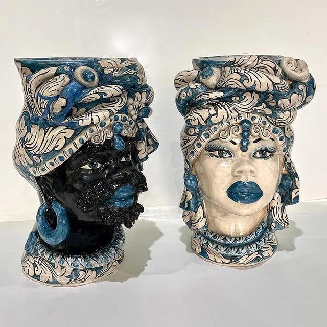 A 1980s exceptional pair of one of a kind hand, sculpted and hand painted ceramic Maurice head vases by Gemano Caltagirone...