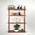 A minimalist mid-century teak shelf unit, designed by Poul Cadovius for Cado, manufactured in Denmark in the 1960s. It is...