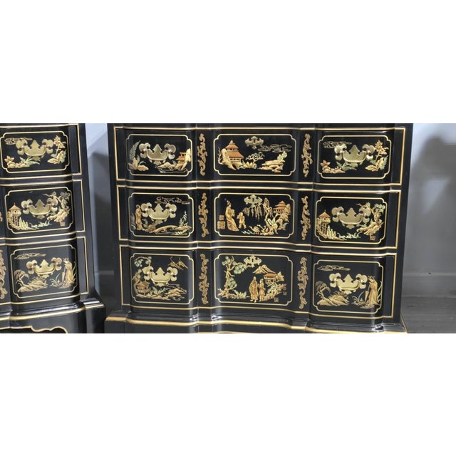 A wonderful pair of chinoiserie lacquered three drawer chests of drawers with protective glass tops, brass handles,...