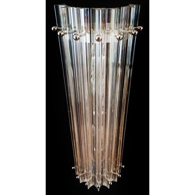 Fantastic pair of vintage Murano wall sconce made by 7 Murano iridescent prism (triedri) for each applique in a chrome...