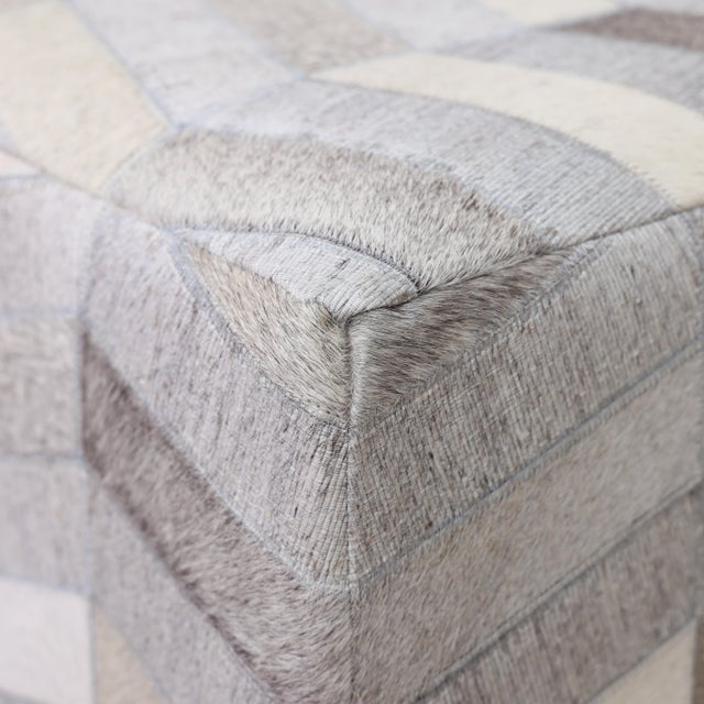 "A study in texture and precision, this handmade cowhide leather pouf introduces a more structured, geometric rhythm to...