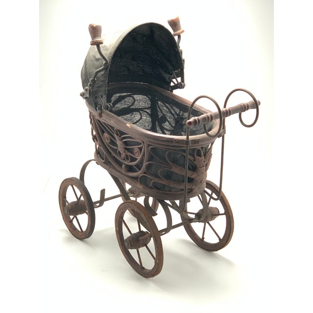 This vintage Victorian Style baby doll carriage is rare find! The carriage is made of wicker, wood and wrought iron. The...