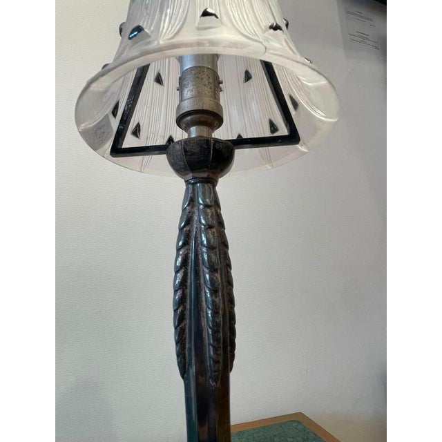 Pair of "Bellis" Table Lamps by René Lalique. This pair of table lamps, adorned with shades featuring the Bellis motif...