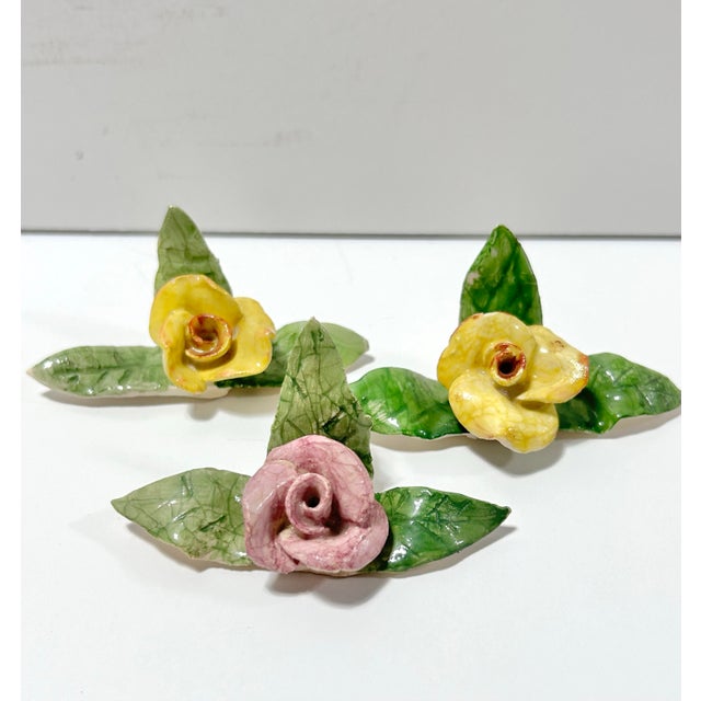 Beautiful handmade porcelain flower place card holders. Some of them are signed by the artist on the bottom. The colors...