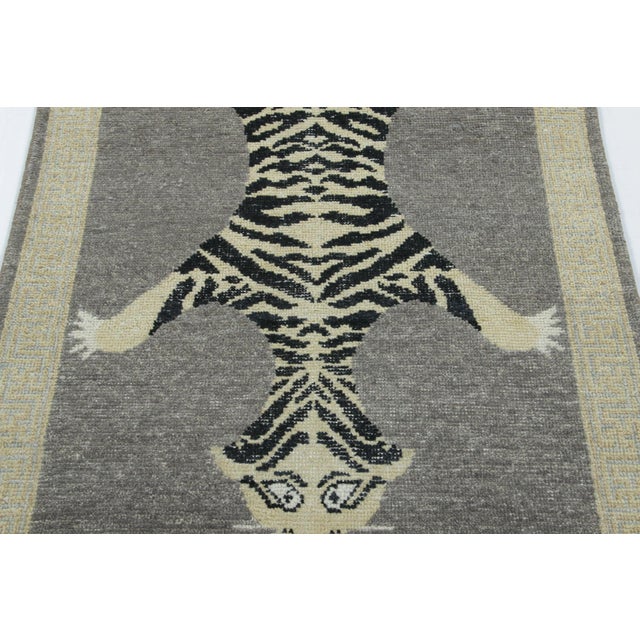 Hand-knotted in wool, this 3x6 runner rug is a striking new addition to our Distressed Homage collection, inspired by a...
