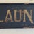 Early 20th Century Antique Large "The Red ★ Laundry" Horizontal Wood Sign With Gold Whimsical Lettering & Red Star For Sale - Image 9 of 17