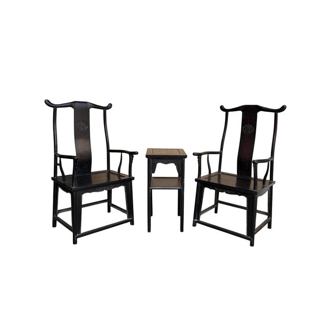 Elevate your living space with this striking three-piece seating set, featuring two Official's Hat (Yoke-Back) armchairs...