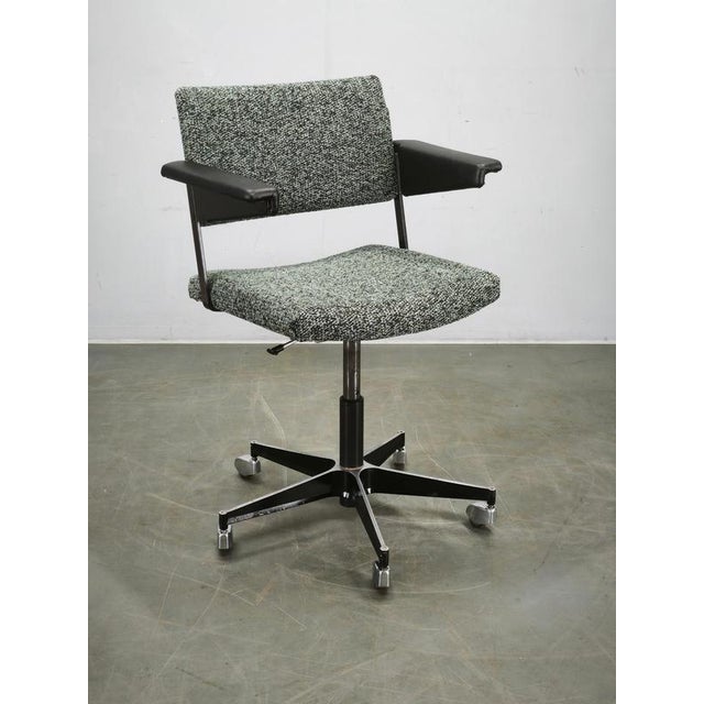 Original height-adjustable swivel office chair designed by André Cordemeyer for Gispen in the Netherlands during the...