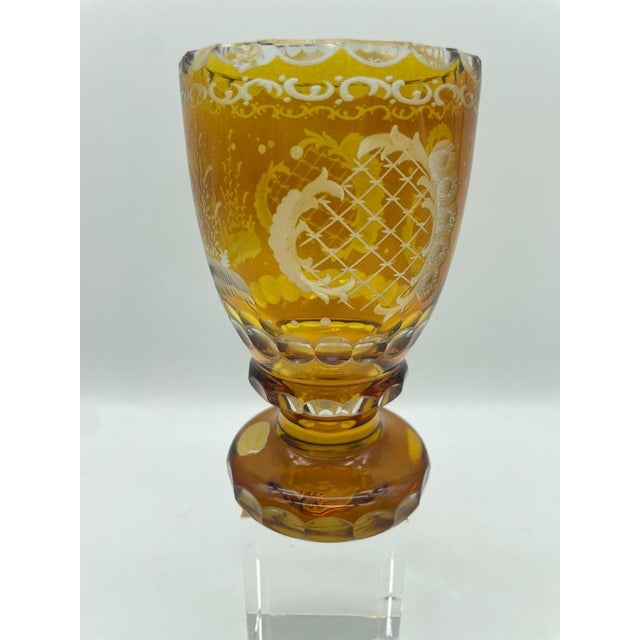 An exceptional pair of handcrafted overlay glass goblets from the renowned Moosbauer manufactory in Nördlingen, Bavaria....