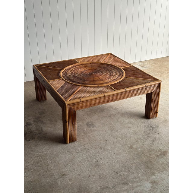 This coffee table is a study in movement — an extraordinary concentric sunburst top of individually applied reedwork...