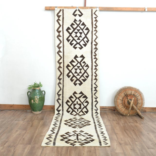 Vintage Turkish Hand-Knotted vintage rug is a semi- vintage runner rug.'70s Eastern region of Turkey's unique rug is...