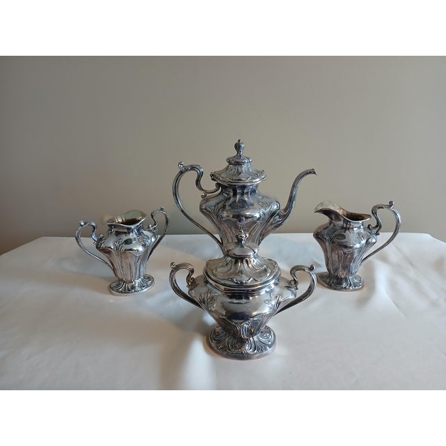 High quality Pairpoint Mfg. quadruple plate silver service set. Art Nouveau scroll design style with flowing lines,...