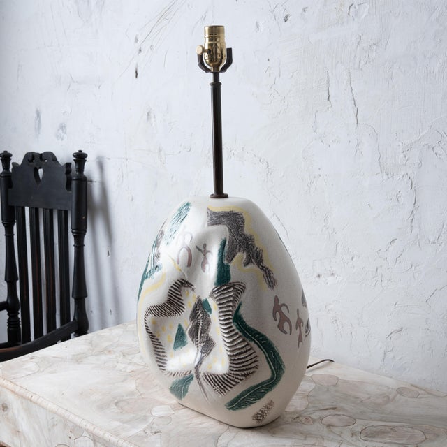 A sculptural table lamp attributed to Marianna von Allesch, 1950s. 12 ¾ inches wide by 7 ½ inches deep by 14 ½ inches...