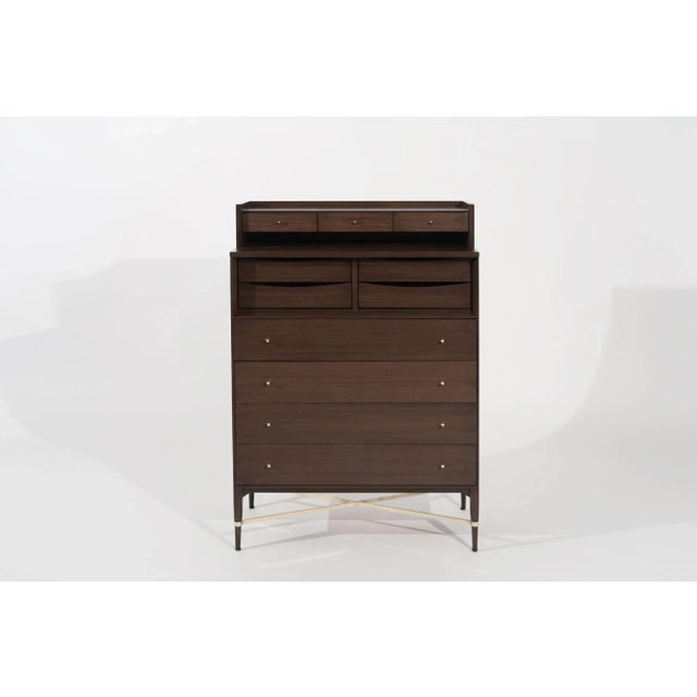 The timeless Mahogany Gentleman's Chest of Drawers designed by legendary designer Paul McCobb in the 1950s, now fully...