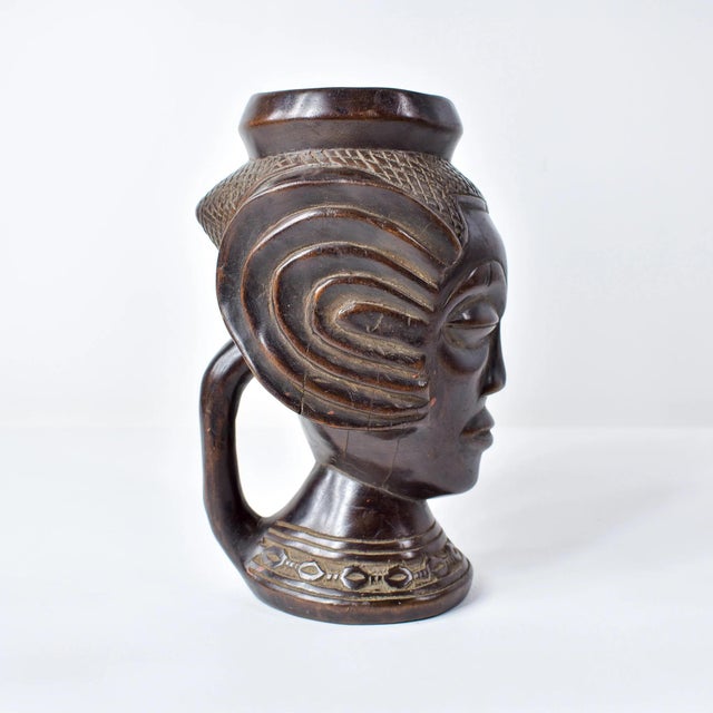 The Kuba people of the Democratic Republic of the Congo are renowned for their intricate figurative carvings, notably seen...