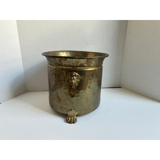 Gorgeous patinaed brass English or French style jardiniere (indoor planter) with heavy patina. Features claw feet and lion...