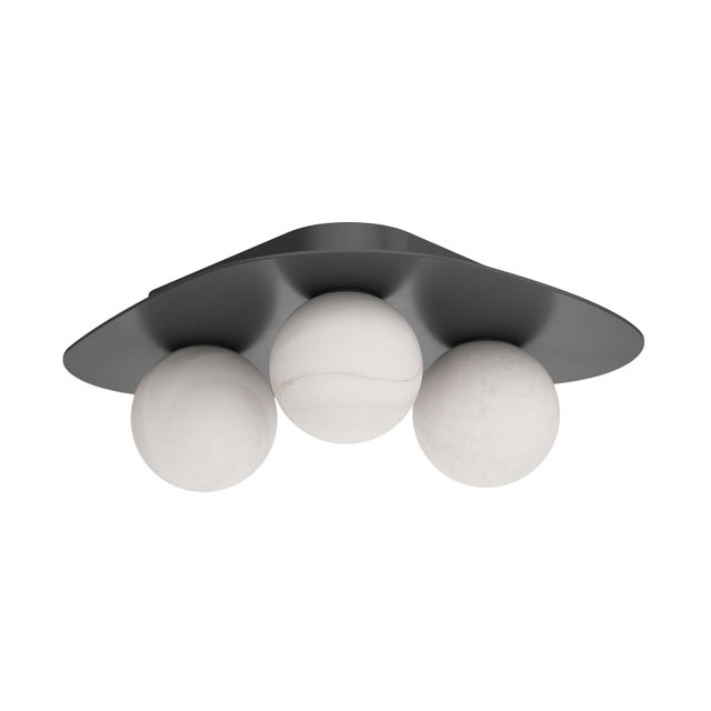 The Rhoads Flush Mount brings sculptural simplicity to the ceiling. Its softly curved triangular canopy cradles three...