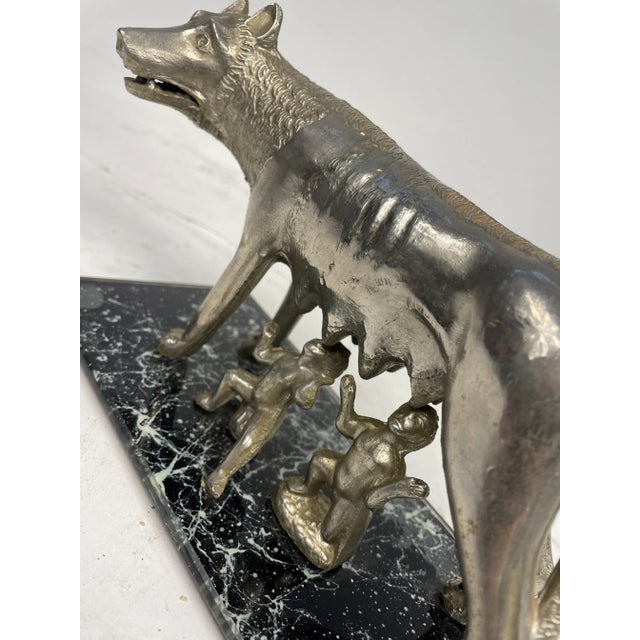 Beautiful sculpture of the famous Capitoline Wolf, awarded as the Symbol of the City of Rome. Made of metal and glass base.