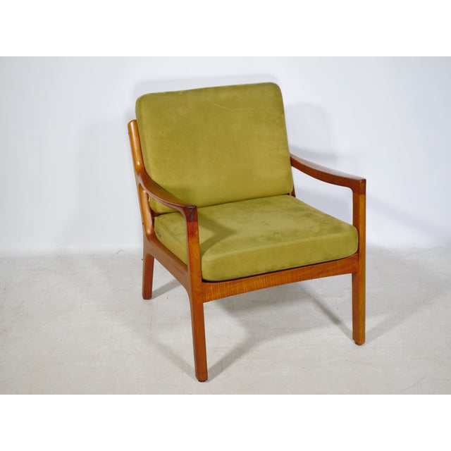 Ole Wanscher "Senator" lounge chair for Cado, Denmark, 1960s. Solid teak frame with gently curved armrests and clean...