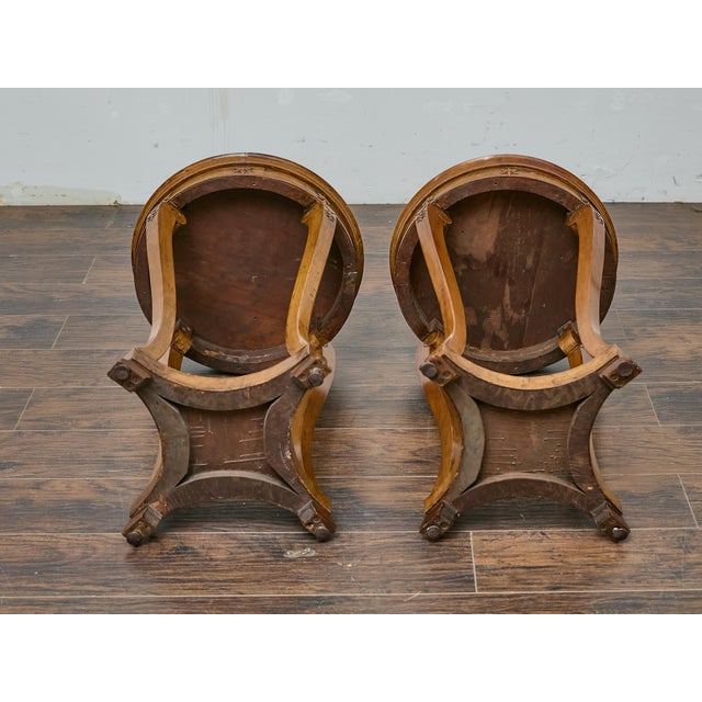A refined pair of 19th-century English Regency walnut tables, blending sculptural elegance with timeless craftsmanship....