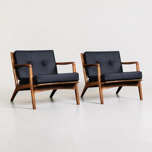 Rare pair of Italian mid‑century lounge chairs by Otto Gerdau (with label). The vintage 1950s chairs have been updated...