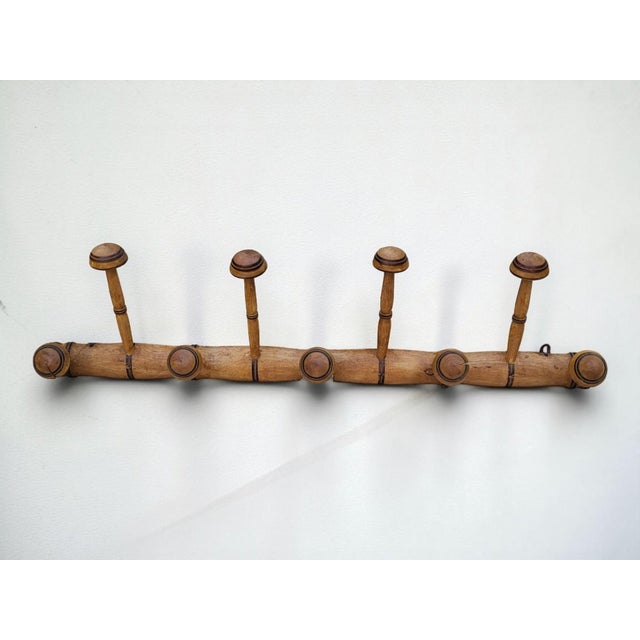 Bamboo wall-mounted coat rack, circa 1900 Length 98.5 cm Height 25 cm Depth 13 cm In good, original condition. One hook is...