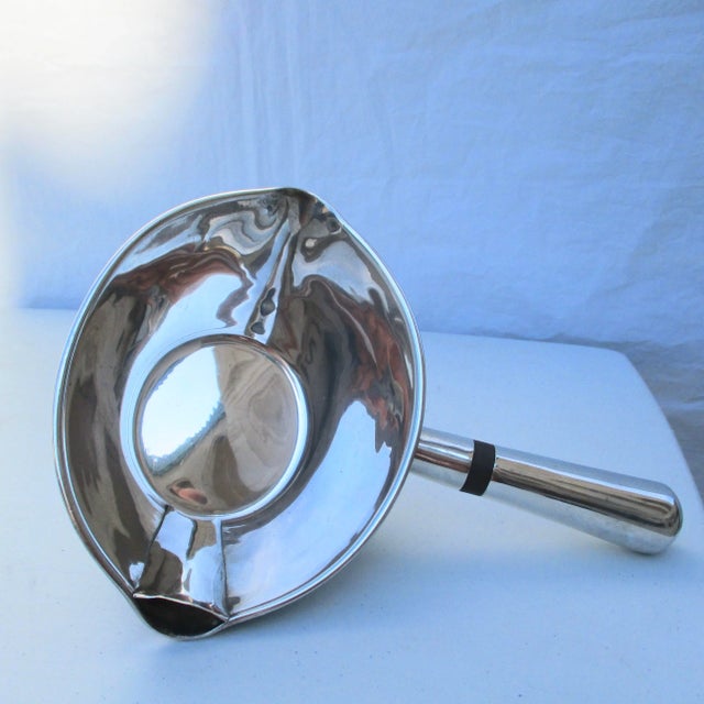 Sterling silver pipkin handcrafted in Mexico. Designed with pour channel to side allowing direct pour of the bottom of the...