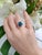 This is an exquisite blue zircon ring, a gemstone admired for its brilliant sparkle and rich blue hue. As one of...