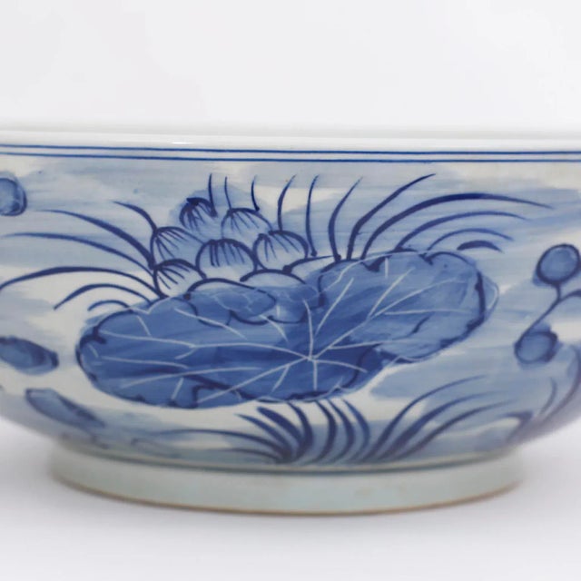 Alluring Chinese blue and white porcelain bowl with a classic form and hand decorated with a lily pond motif around the...